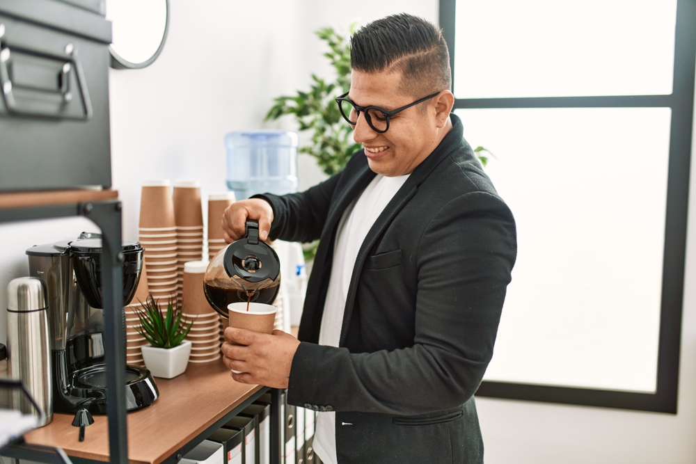 Young,Latin,Businessman,Smiling,Happy,Drinking,Coffee,At,The,Office.